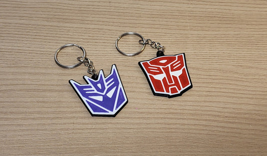 Transformers Insignia Keychains – Choose Your Side